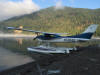 Cessna 182 floating on lake