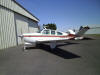 Bonanza in front of maintenance hangar