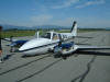 Beech pressurized Baron just after gear up landing